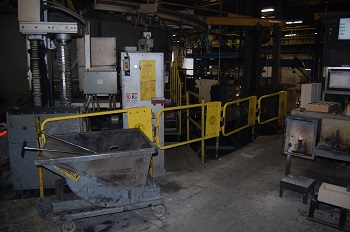 Industrial safety gate around hazardous equipment
